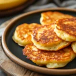 Stack of banana pancakes without eggs on a rustic plate
