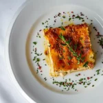No-boil lasagna noodles slice with cheese and herbs