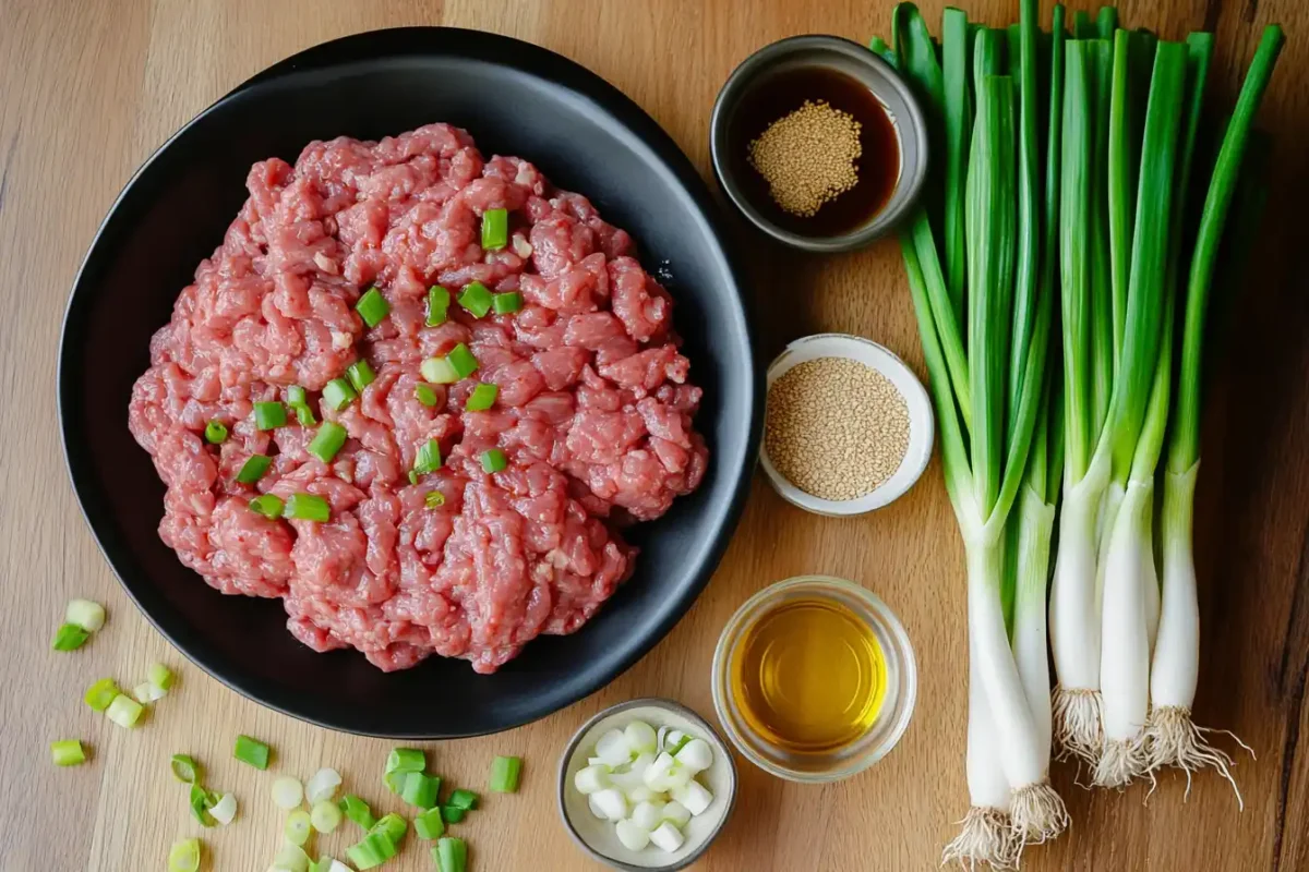 Fresh ingredients including ground beef soy sauce garlic and ginger